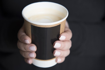 A cup of coffee in hands