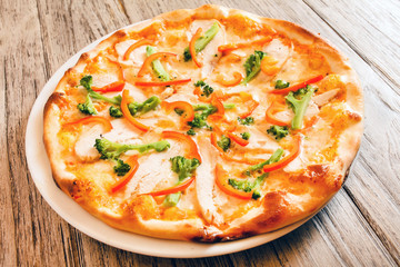 pizza on wooden background