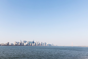 Naklejka premium cityscape of modern city near river