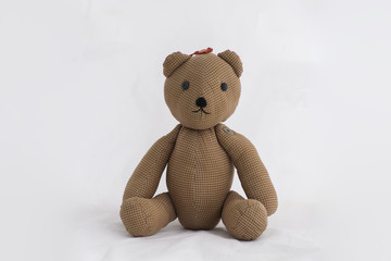 Teddy Bear made of fabric Sitting on a white background