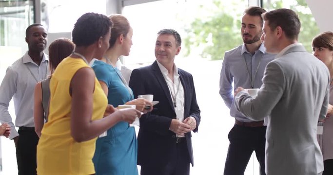 Business executives shaking hands at a networking event