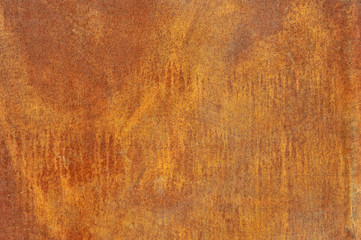 Orange brown old rusted corroded metal or steel sheet horizontal wall background as abstract dirty textured metallic vintage industrial closeup for retro grungy surface design. A rough iron aged plate