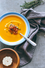 Autumnal pumpkin soup, with a ham, thyme, garlic and cream