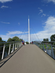 People on modern foot bridge