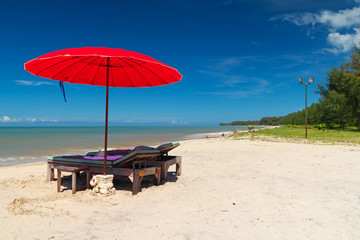Tropical beach scenery with parasol in Thailand