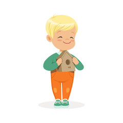 Cute smiling little boy standing and holding birdhouse cartoon vector Illustration