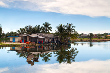 Small village house at the river in Thailand