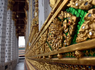 Thai Glass Mosaic wall decorative ornament from colorful glass in Wat Arun. A fragment of decoration with flowers.