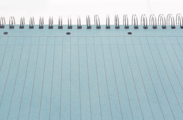 Lined page of notebook with metal rings, blue paper