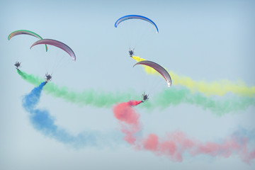 The Flying Dragons aerobatic group of paramotor flying in the Air Show Radom 2017.