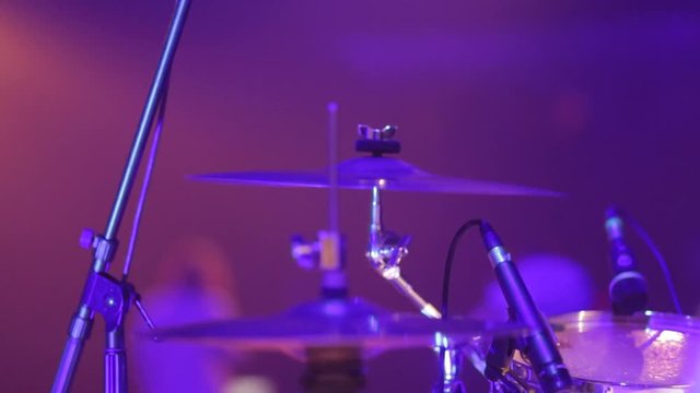 The musician plays the drums