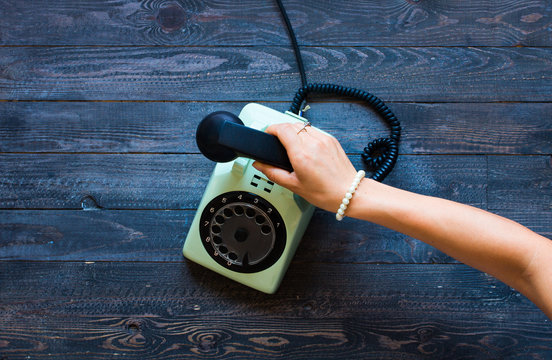 Vintage telephone, coffe, biscotti, phone call, sad woman, free space for text.