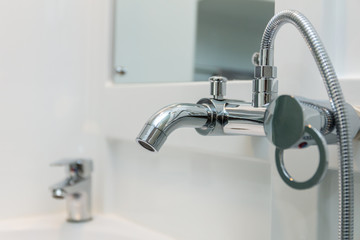Close up of chrome bath shower tap