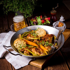 Grilled chicken wings with caramelized carrots