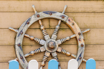 old wooden Handwheel on wooden background