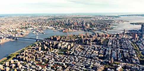 Tuinposter Aerial view of the Lower East Side of Manhattan the Brooklyn and Manhattan bridges © Tierney