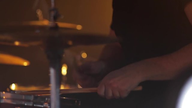 The musician plays the drums