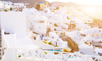 Oia town on Santorini island, Greece. Traditional and famous white and rose  houses at sunny day