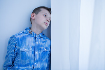 Worried boy spends afternoon alone