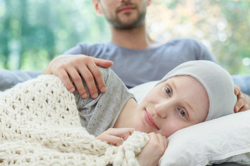 Ill woman resting on couch