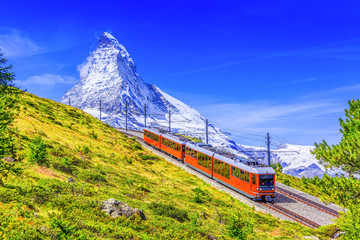 Zermatt, Switzerland. Gornergrat tourist train with Matterhorn mountain in the background. Valais region. - obrazy, fototapety, plakaty