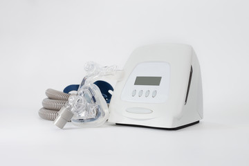 Full components of Cpap machine on white background,selective focus..Cpap Continuous positive airway pressure system includes of main unit,mask,tube and headgear,healthcare concept.