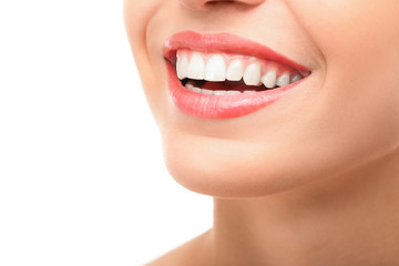 Fototapeta premium Beautiful young woman with healthy teeth on white background