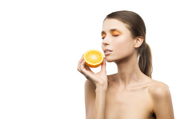 Beautiful girl a portrait with the sliced orange on a white background