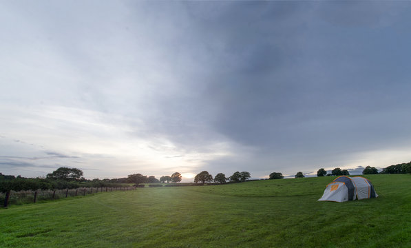 Dusk In An English Cotswolds Countryside Field