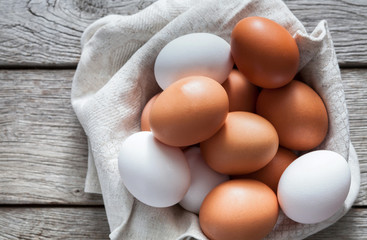 Fresh chicken brown eggs on rustic wood, organic farming concept