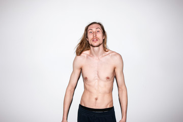 Fototapeta na wymiar Topless man portrait. Naked photoshoot. Modern fashion youth, aggressive young male