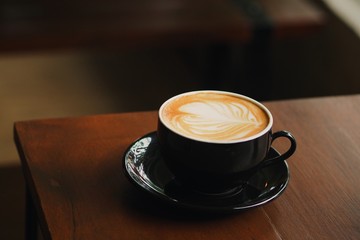 coffee cup on wooden table.