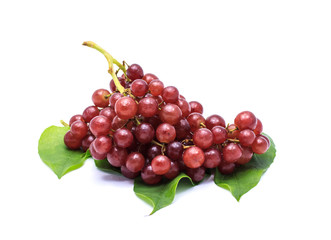 Ripe red grape. Pink bunch with leaves on white background