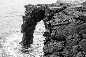 Stone arch over ocean