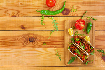 Mexican tacos with beef in tomato sauce