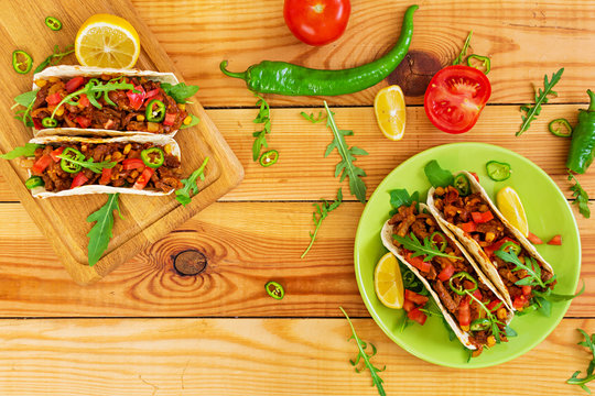 Mexican tacos with beef in tomato sauce