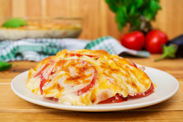 Eggplant casserole. Moussaka on wooden background