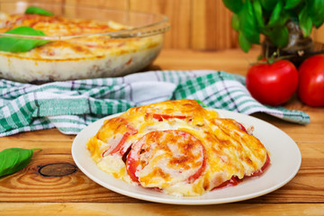 Eggplant casserole. Moussaka on wooden background