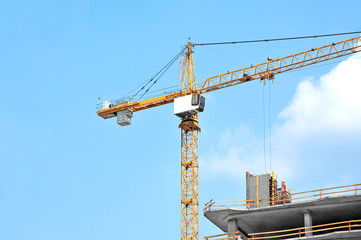 Crane and highrise construction site