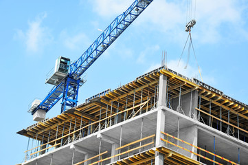 Crane and highrise construction site