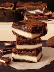 Brownie with cheesecake filling is cut into small squares