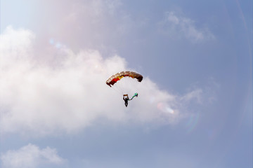 parachutist in a summer sky