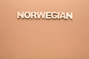 Word Norwegian on beige background