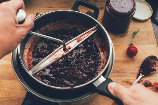 Preparing homemade strawberries jam