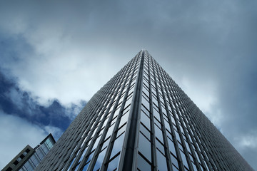 Fototapeta na wymiar Modern building with clouds