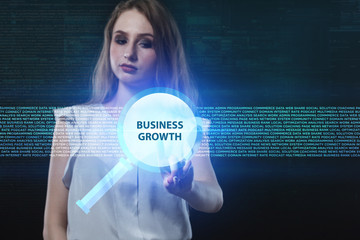 The concept of business, technology, the Internet and the network. A young entrepreneur working on a virtual screen of the future and sees the inscription: Business growth