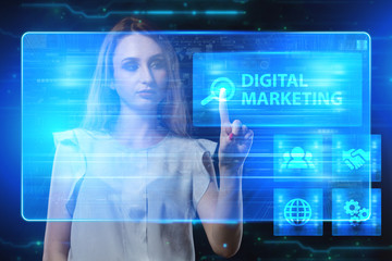 The concept of business, technology, the Internet and the network. A young entrepreneur working on a virtual screen of the future and sees the inscription: Digital Marketing