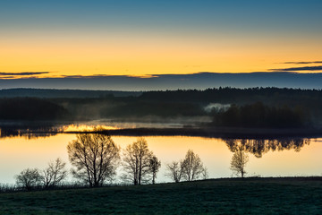 Dawn over the lake Pozezdrze on Masuria, Poland