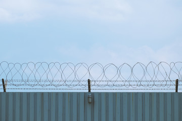 steel wave plate  wall with barbed-wire , imprison area