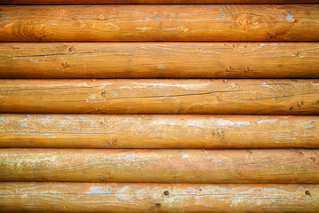 Log cabin or barn debarked wall textured background. Wall of a log house with copy space